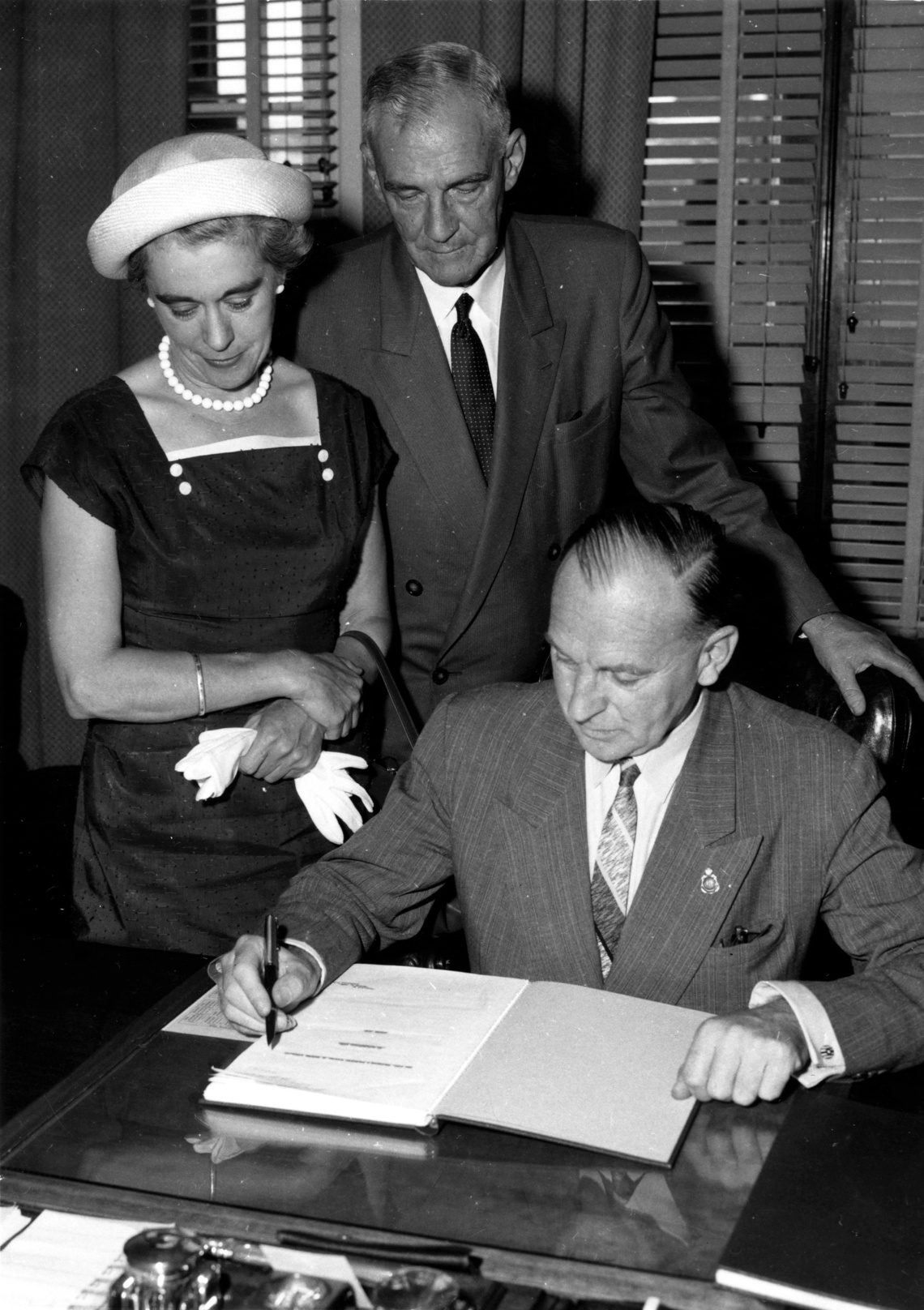 Mollie Lukis watches book signing