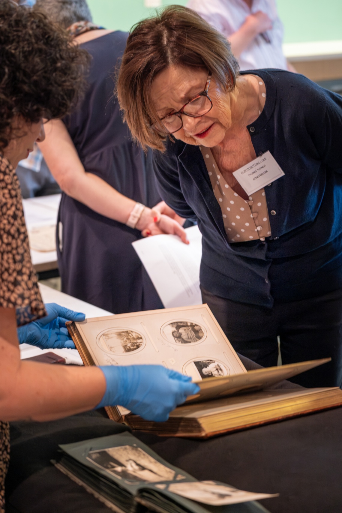 Members of the Turner family looking at collection items