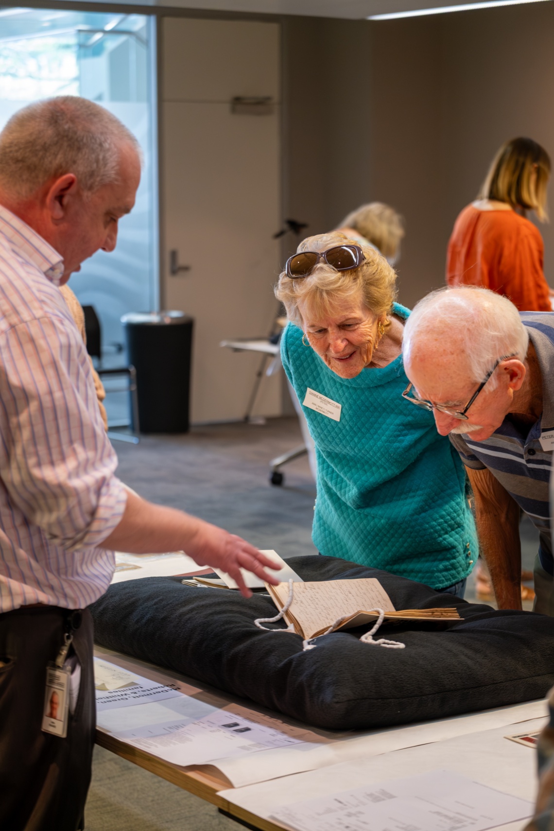 Members of the Turner family of Augusta looking at collection items  at the State Library