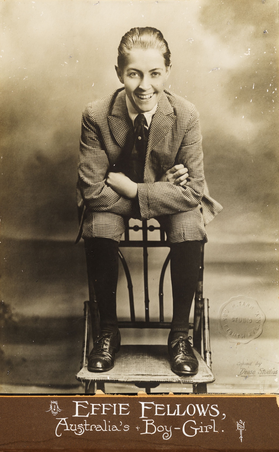 Studio portrait of Effie Fellows dressed in a knickerbocker suit