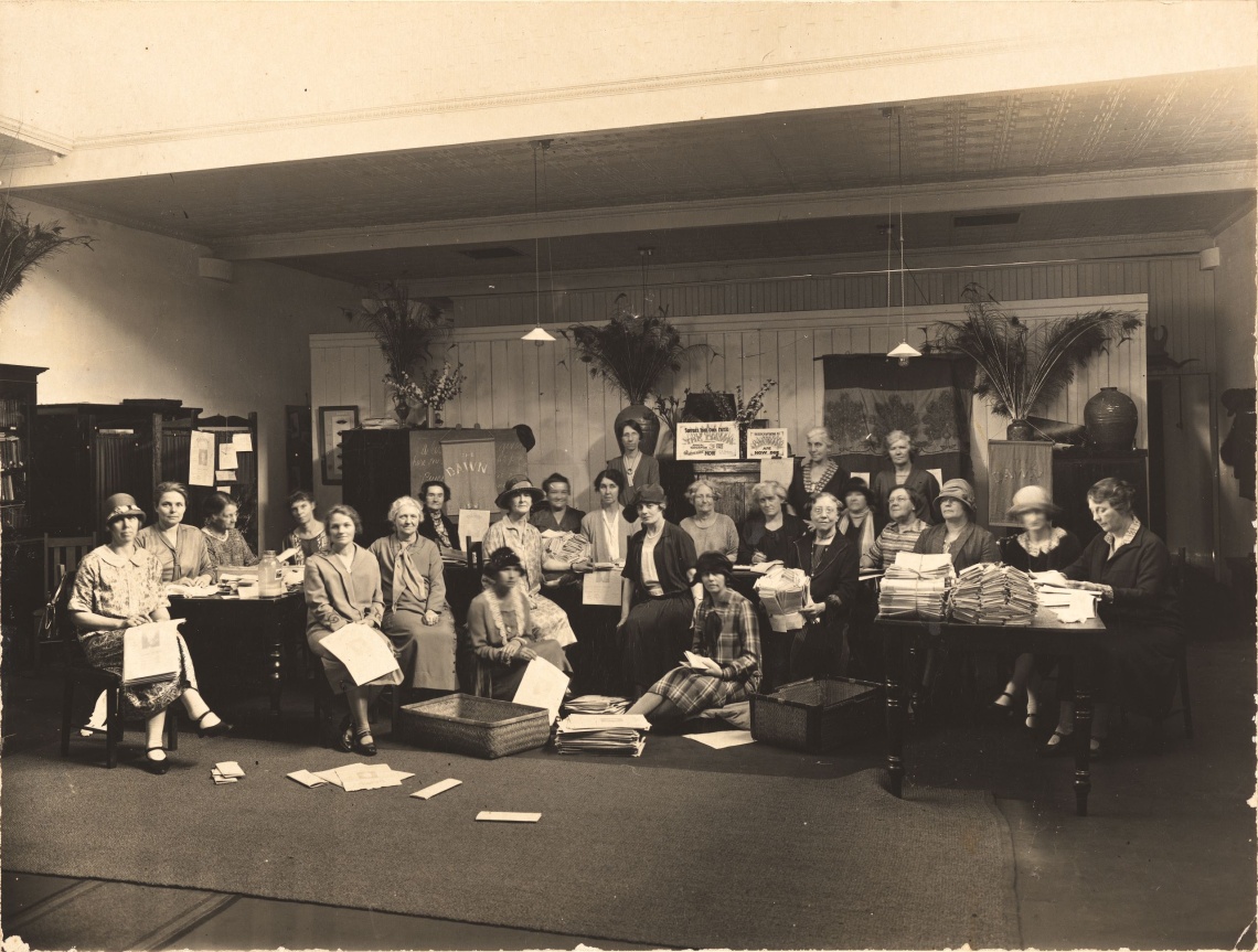 Members of the Womens Service Guilds wrapping the Dawn newspaper at their headquarters at Viking House William Street Perth Western Australia ca 1925