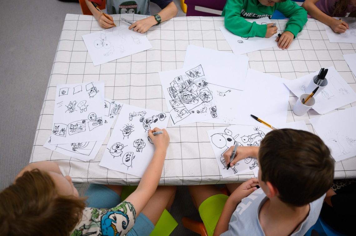 Drawing at a comic book workshop with Aka