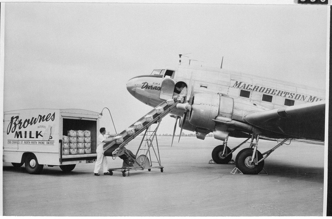 Unloading the Brownes dairy van onto a plane 1960s