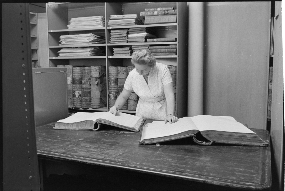 Margaret Medcalf checking ledgers