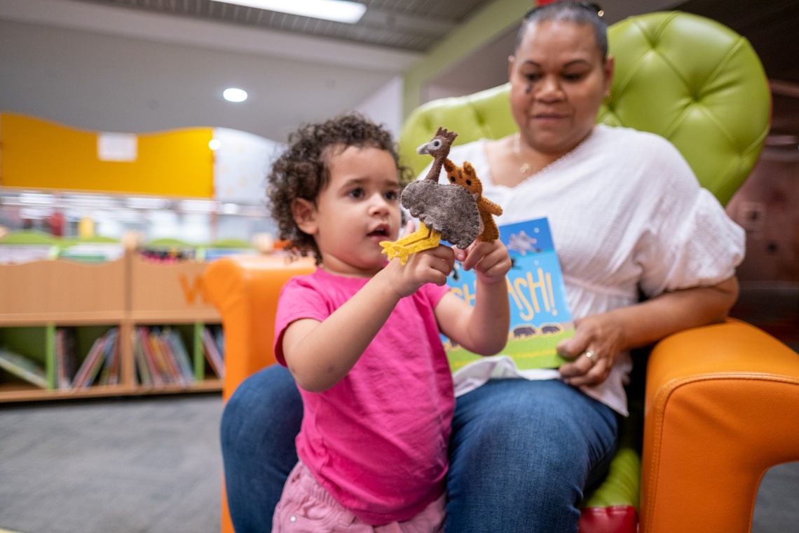Playing with an animals toys in The Story Place