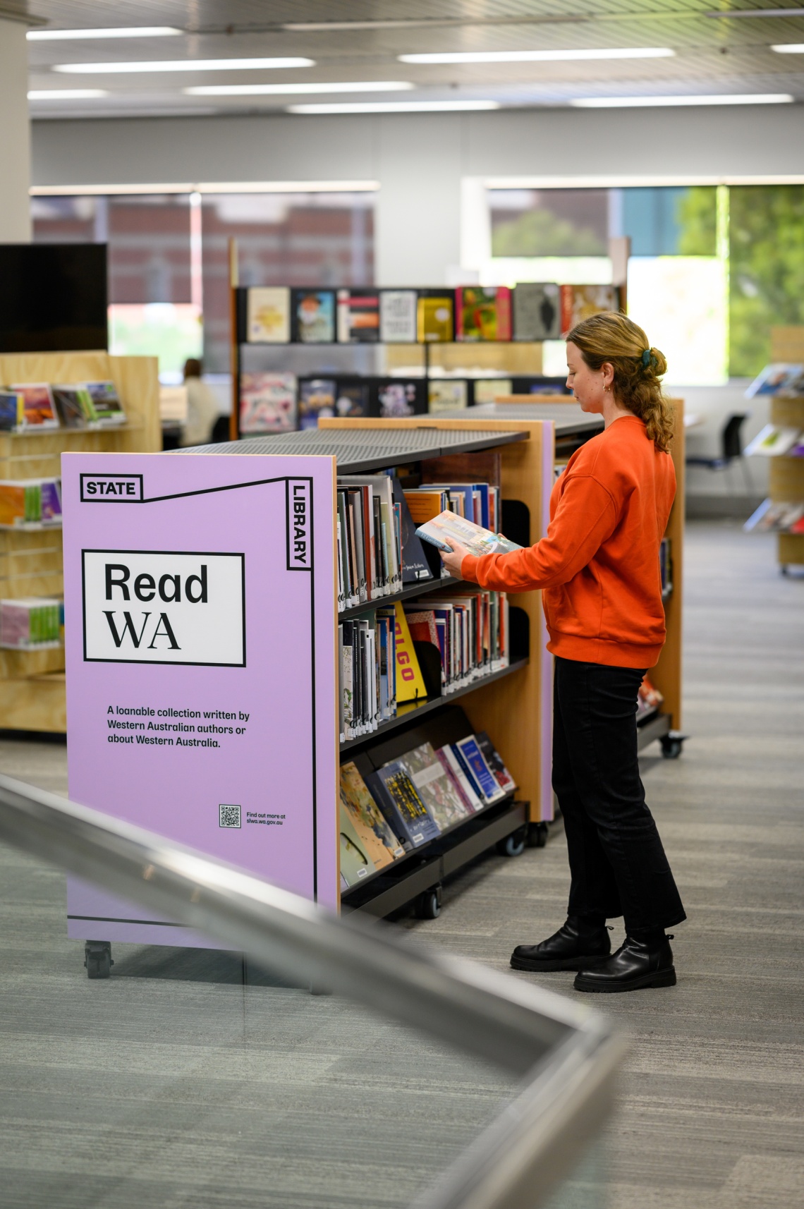 Person looking at Read WA Collection