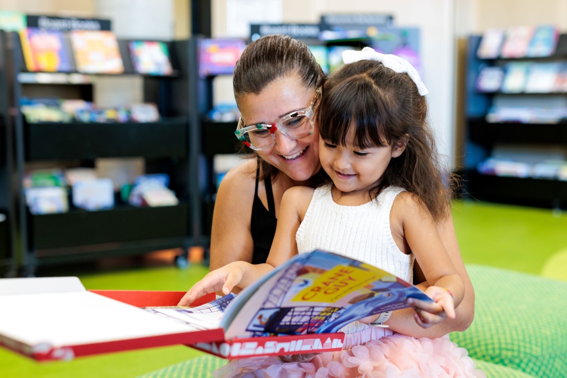 Mother and child looking at book at the Ruth Faulkner Library in Belmont 2026