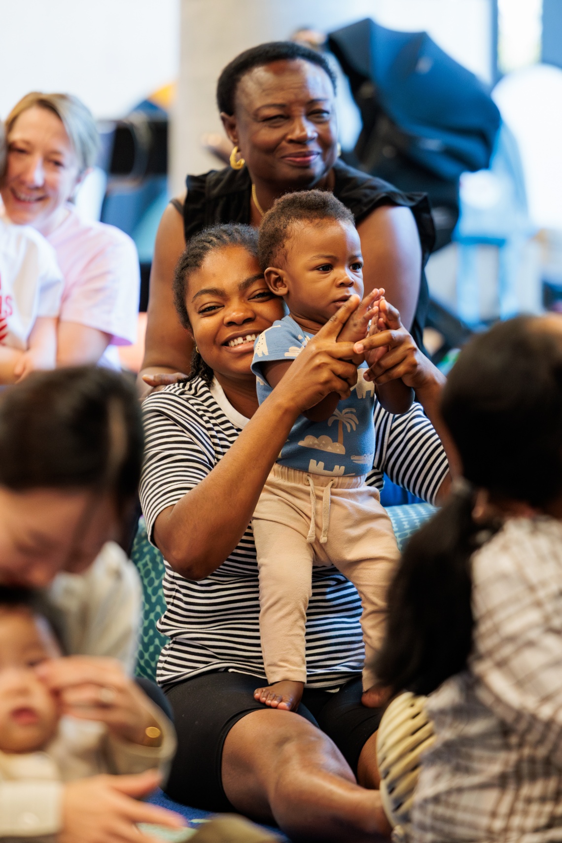 Mom and baby enjoying Rhyme Time at Ruth Faulkner Library