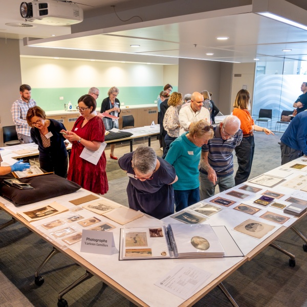 Members of the Turner family of Augusta at the State Library looking at collection items