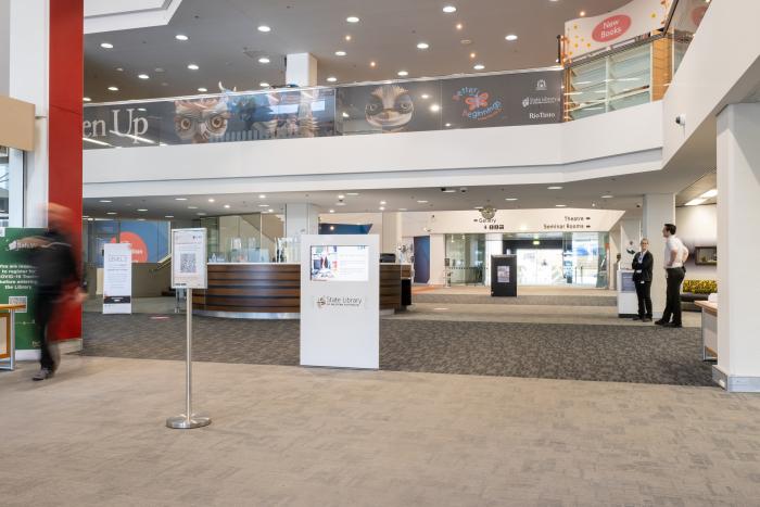 The library foyer from the cultural centre door showing signage and desk