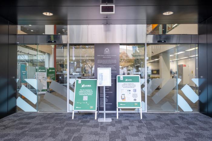 View into the library through the open doors on the cultural centre side showing the two access points