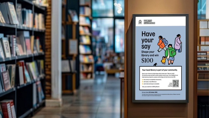 A poster on the side of bookshelves in a local library reads Have your say