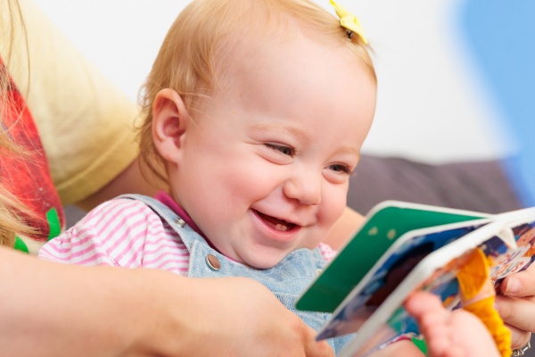 Baby looking at book