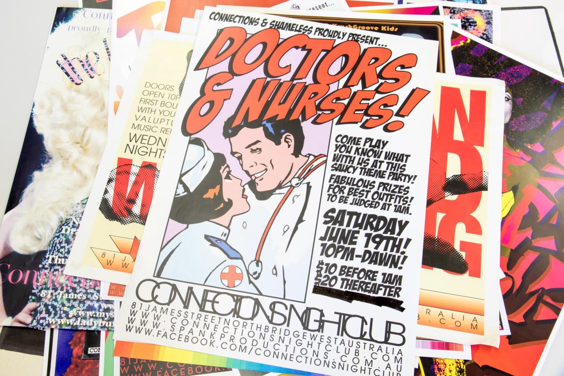 Photo of scattered colourful posters donated to the Library