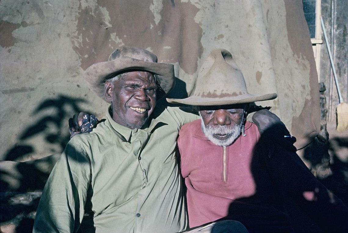 Two men embracing each other