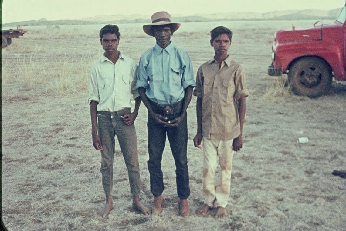 Three men standing together