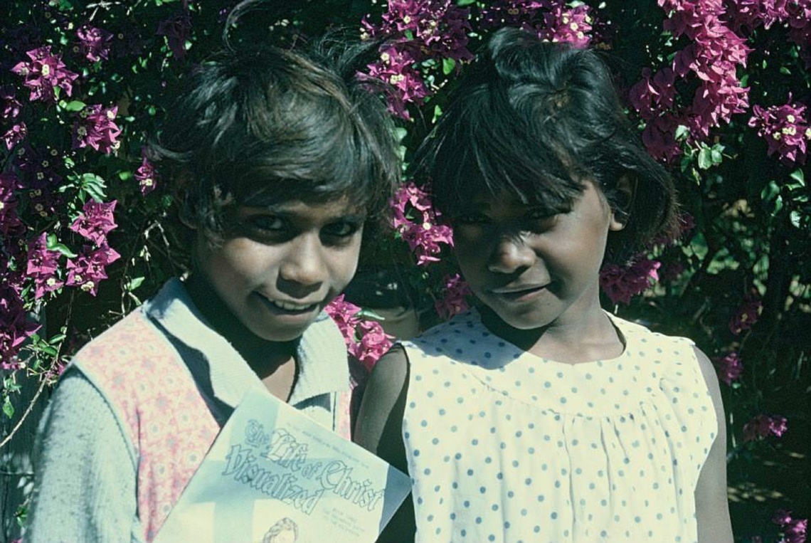 Two young girls standing together
