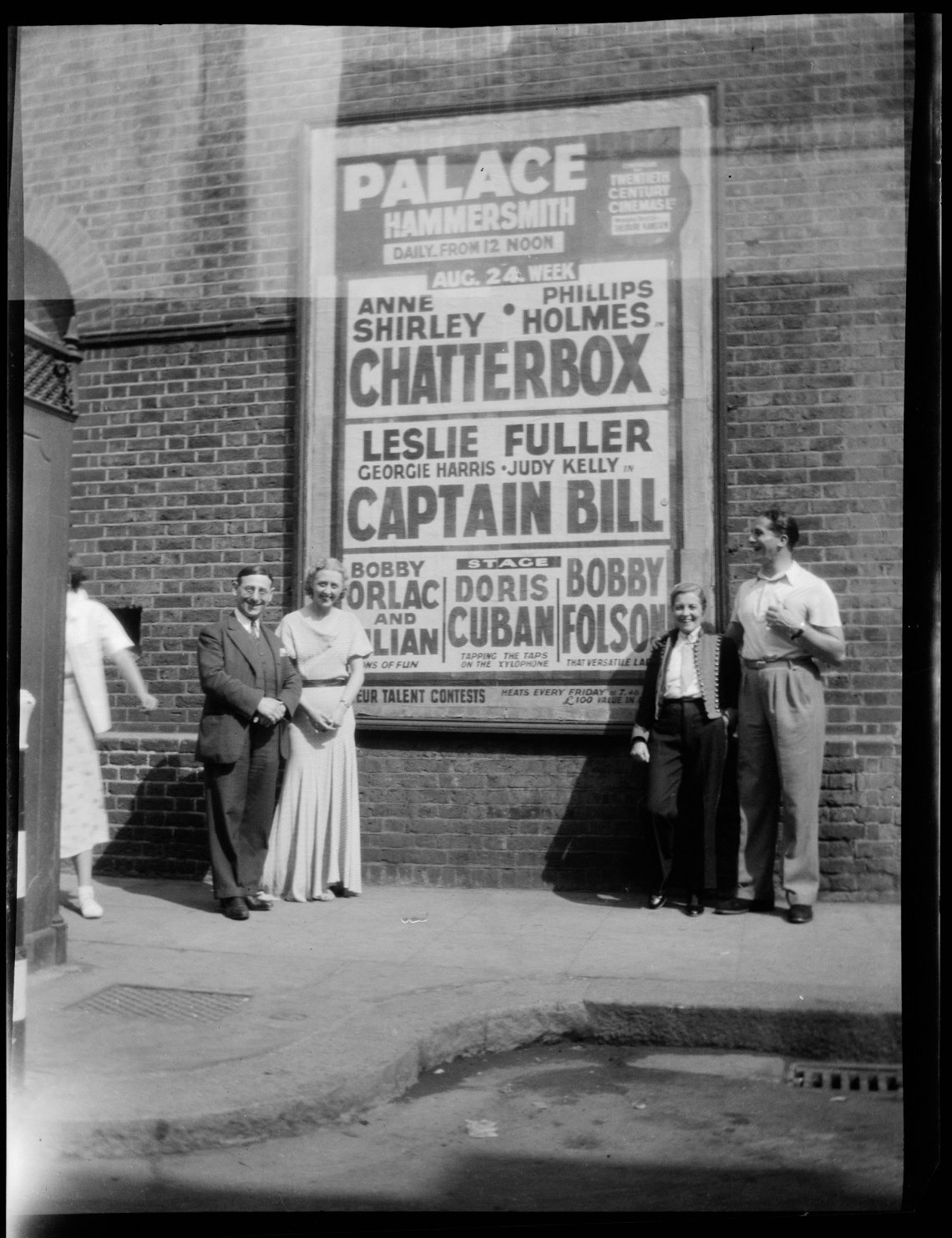 Effie Fellows inside right and others with advertising billboard in London