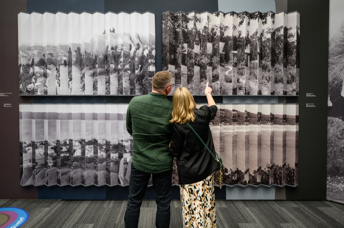 Image of two people attending an exhibition
