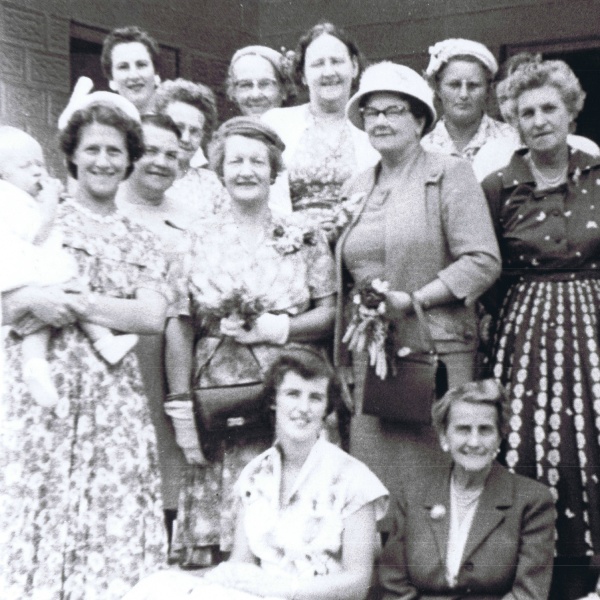 Yearling CWA members and friends in front of new building 1955